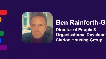 Profile image with rainbow stripes and text about a director in a housing group.