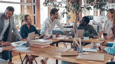 Group of people having a meeting in a modern office space.