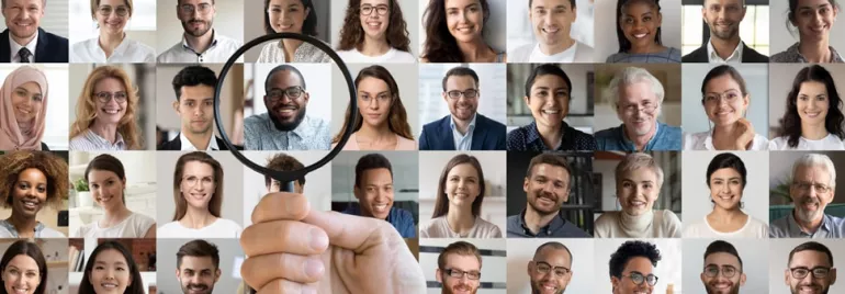 Collage of diverse smiling individuals with a magnifying glass focusing on one person.