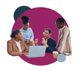 Group of professionals discussing around a laptop and coffee cups.