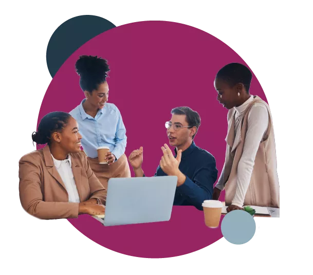 Four people having a discussion around a laptop with coffee cups.